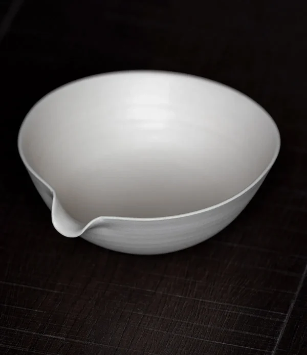Artist Collaboration Cream Ceramic Pouring Bowl in oatmeal — in a room setting