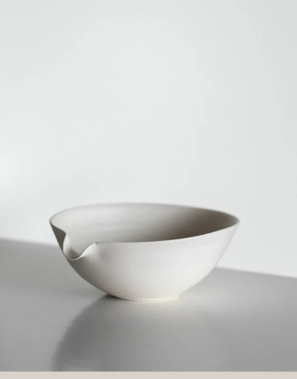 Artist Collaboration Cream Ceramic Pouring Bowl in oatmeal — in a room setting