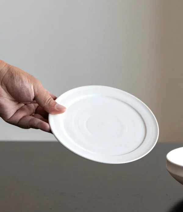 Plain White Ceramic Shallow Bowl and Plate in ivory — in a room setting