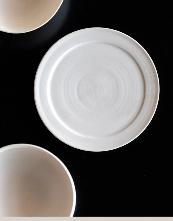Plain White Ceramic Shallow Bowl and Plate in ivory — in a room setting