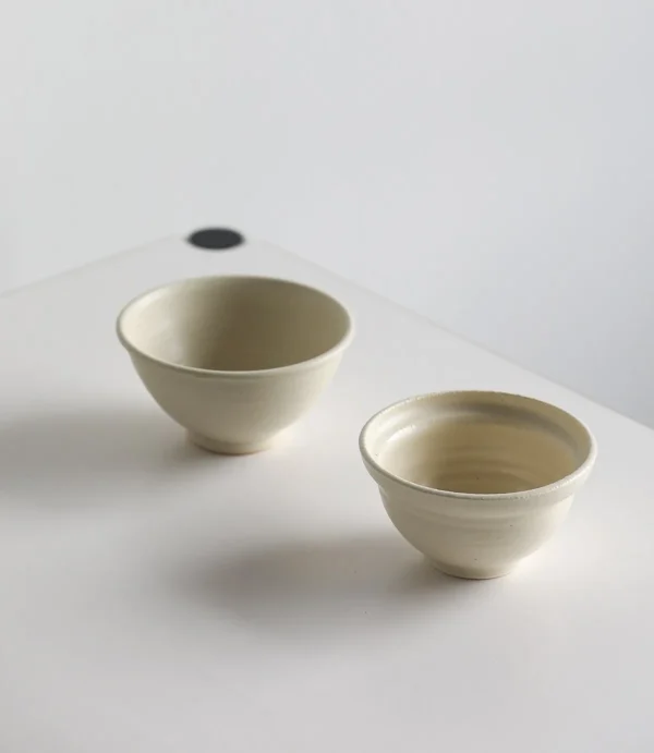 Artist Collaboration Rice-Glaze Plain Ceramic Bowl in oatmeal — in a room setting