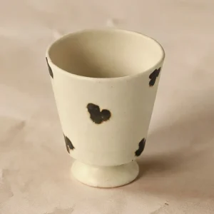 Artist Collaboration Dotted Stoneware Latte Cup, Cream in oatmeal — front view
