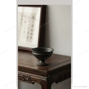 Artist Collaboration Antiqued Footed Ceramic Bowl, Brown or in clay — in a room setting