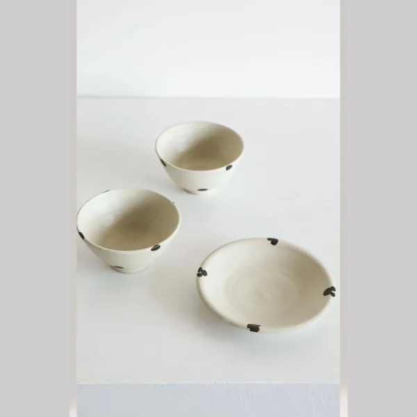 Artist Collaboration White Glaze Ink-Dot Ceramic Bowls and in ivory — in a room setting