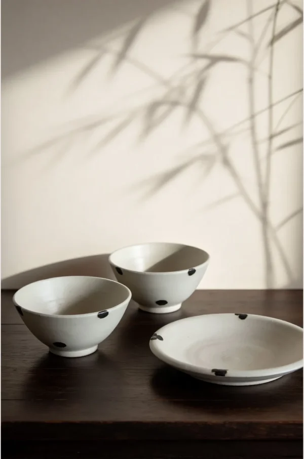 Artist Collaboration White Glaze Ink-Dot Ceramic Bowls and in ivory — in a room setting