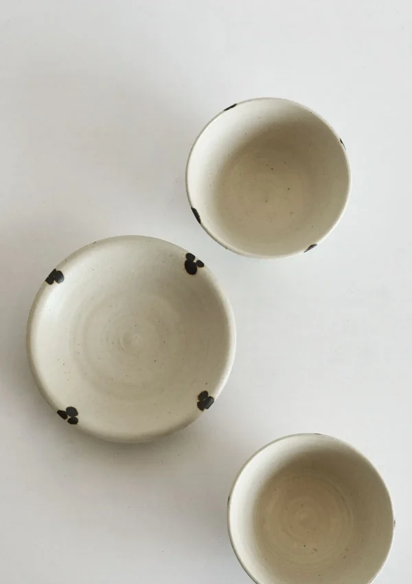 Artist Collaboration White Glaze Ink-Dot Ceramic Bowls and in ivory — in a room setting