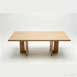 Androgyne White Oak Long Dining Table on Sculpted Legs in natural oak — in a room setting