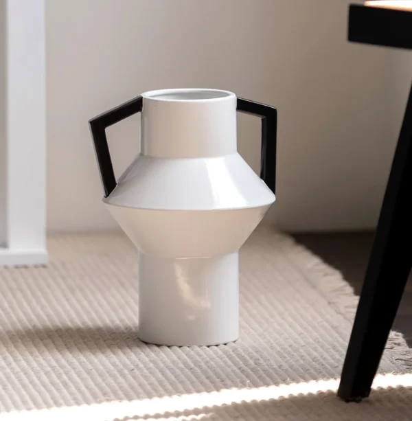 Angular Black Ceramic Vase with Red Square Handles in black — in a room setting