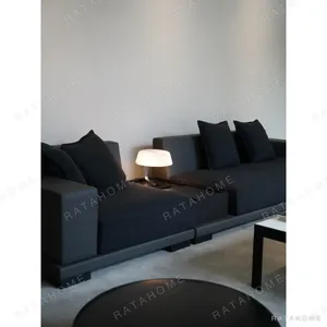 Low Sofa in Black Wool with Oak Frame Feet, 360 cm — in a room setting