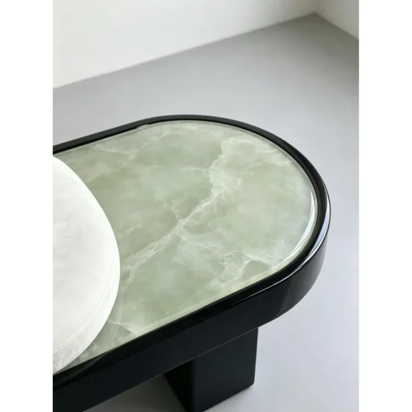 Oval Jade Stone Bench with Velvet Cushion on Black Base in olive — in a room setting