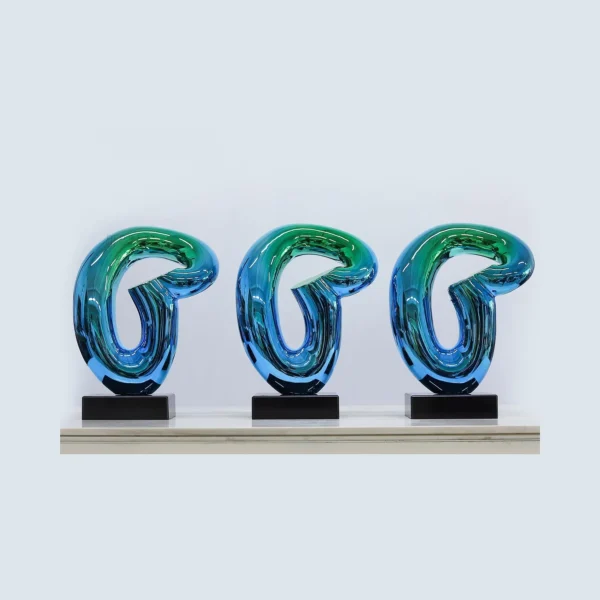 Blue-Green Glass Loop Sculpture on Black Base, 30 x 43.5 cm in blue — in a room setting