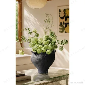 Art Textured Black Ceramic Vase with Torn Rim, Two Forms in black — in a room setting