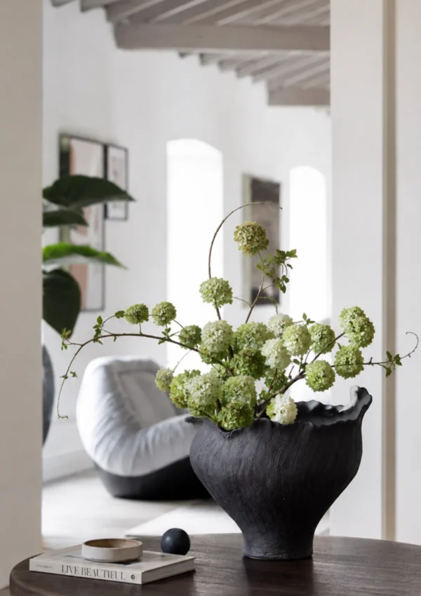 Art Textured Black Ceramic Vase with Torn Rim, Two Forms in black — in a room setting