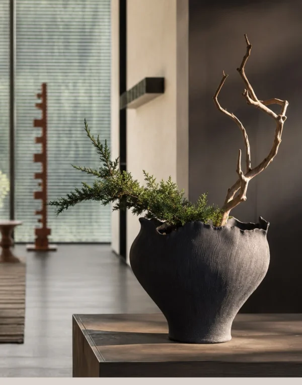 Art Textured Black Ceramic Vase with Torn Rim, Two Forms in black — in a room setting