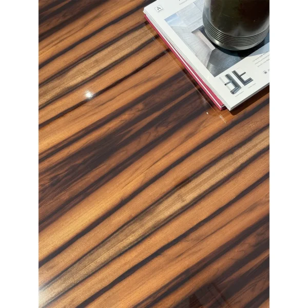 High-Gloss Macassar Grain Coffee Table with Black Metal Legs in clay — in a room setting