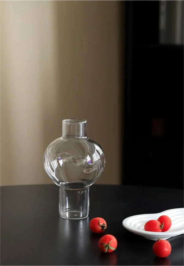 Clear Borosilicate Glass Sphere Vase, Medium in ivory — in a room setting