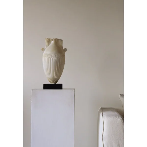 Jade-Effect Fluted Amphora Vase on Black Base in ivory — in a room setting