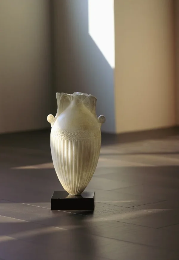 Jade-Effect Fluted Amphora Vase on Black Base in ivory — in a room setting