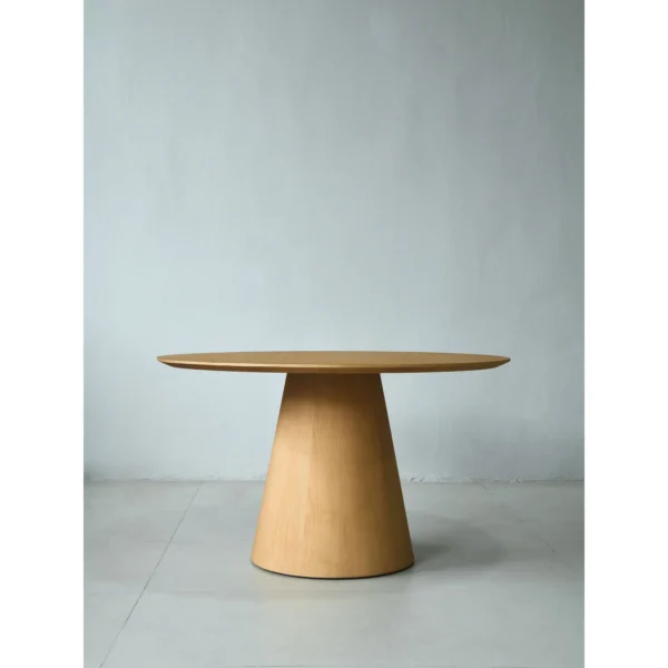 Solid Ash Round Dining Table on Cone Base in natural oak — in a room setting
