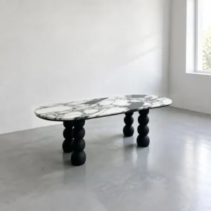 White Marble Oval Table on Black Ash Sphere Legs in ivory — front view