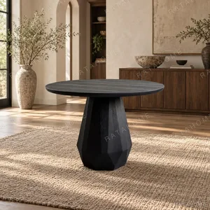 Matte Black Ash Round Table on Faceted Gem Base in black — in a room setting