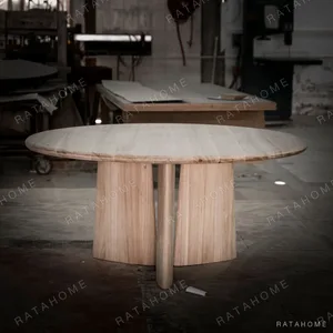 Ash Round Dining Table on Curved Panel Base, Unfinished in natural oak — in a room setting