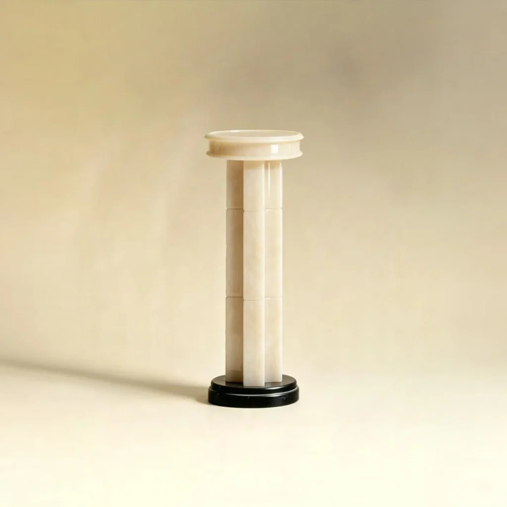 Tall Stacked Stone Sculpture Pedestal on Black Base in oatmeal — front view