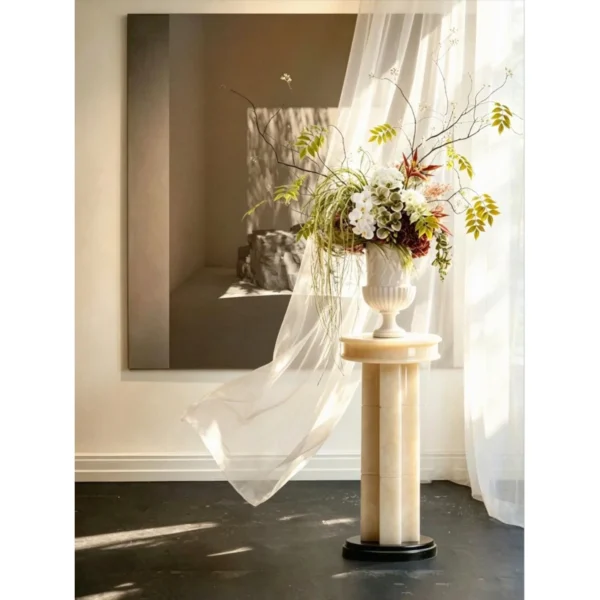 Tall Stacked Stone Sculpture Pedestal on Black Base in oatmeal — in a room setting