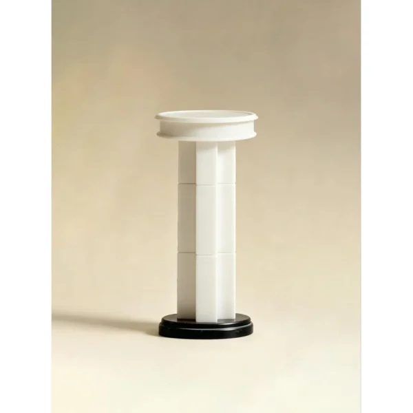 Tall Stacked Stone Sculpture Pedestal on Black Base in oatmeal — in a room setting