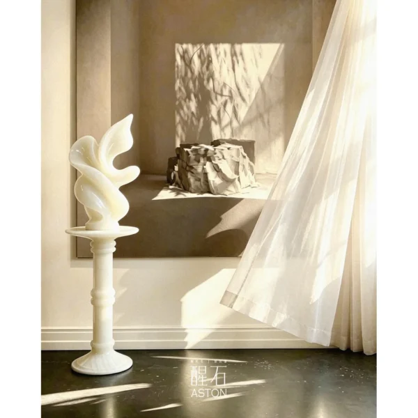 White Onyx Sculpture Pedestal with Flared Base in ivory — in a room setting