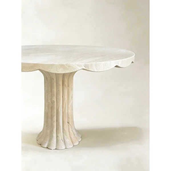Scalloped Travertine Pedestal Table with Fluted Base in oatmeal — in a room setting