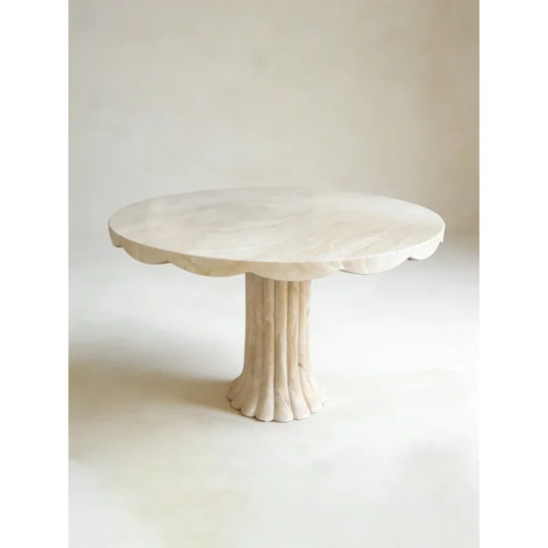 Scalloped Travertine Pedestal Table with Fluted Base in oatmeal — in a room setting