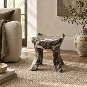 Lan Hand-Carved Marble Art Stool in slate — in a room setting