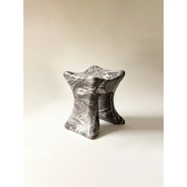 Lan Hand-Carved Marble Art Stool in slate — in a room setting