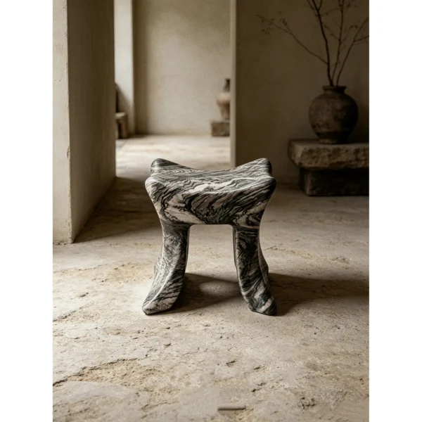 Lan Hand-Carved Marble Art Stool in slate — in a room setting