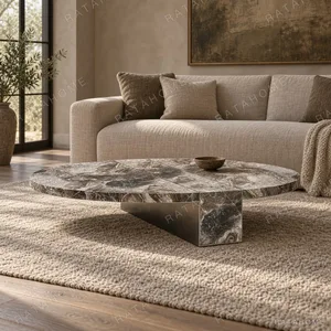 Minimalist Grey Marble Round Coffee Table on Triangular Base in slate — in a room setting