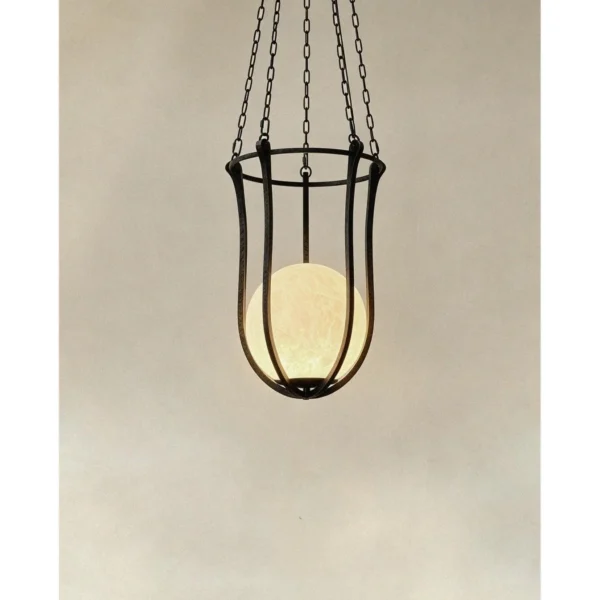 Star Dome Iron Cage Pendant Light with Stone Sphere in black — in a room setting