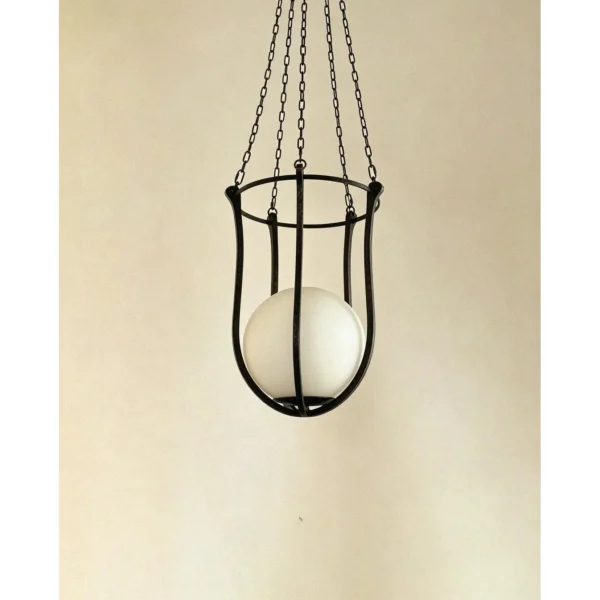 Star Dome Iron Cage Pendant Light with Stone Sphere in black — in a room setting