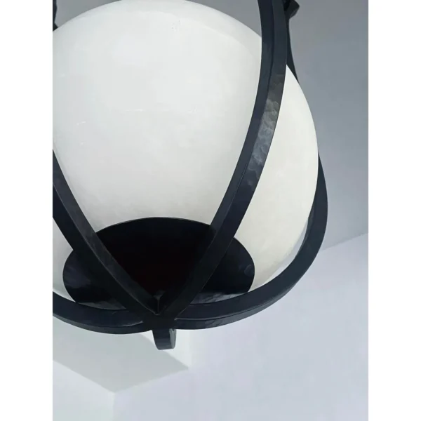 Star Dome Iron Cage Pendant Light with Stone Sphere in black — in a room setting