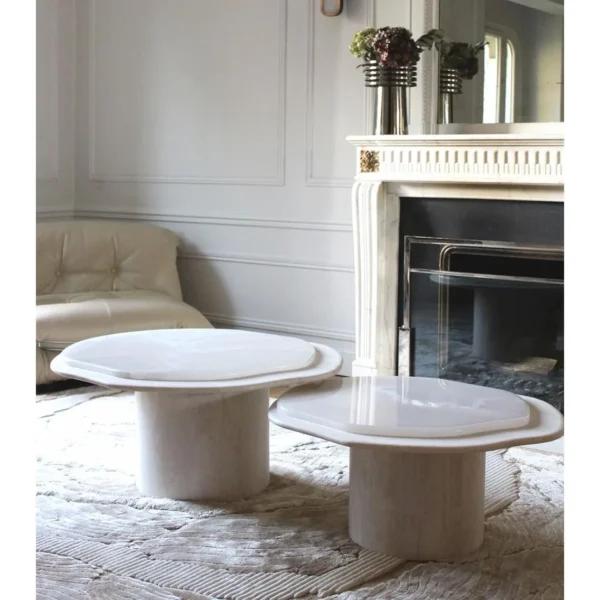 Super White Travertine Nesting Coffee Tables with Lobed Tops in ivory — in a room setting