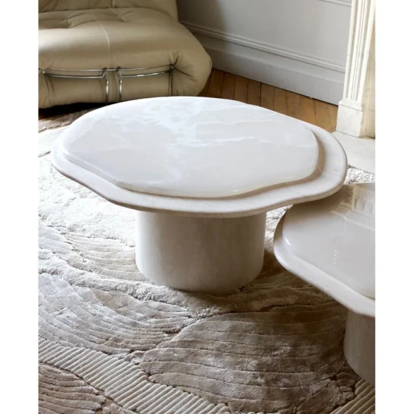 Super White Travertine Nesting Coffee Tables with Lobed Tops in ivory — in a room setting