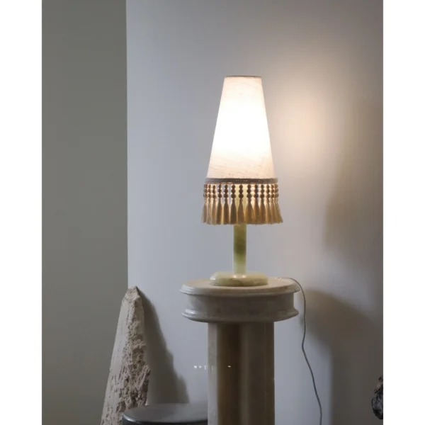 Woven Shadow Fringed Fabric Table Lamp in oatmeal — in a room setting