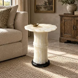 Xuetang Eight-Petal Begonia White Onyx Side Table in ivory — in a room setting