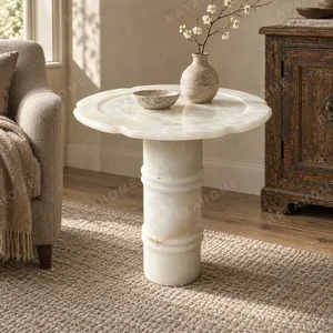 Xuezhan Snow Cup White Onyx Side Table with Plum Blossom Top in ivory — in a room setting
