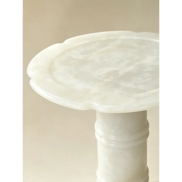Xuezhan Snow Cup White Onyx Side Table with Plum Blossom Top in ivory — in a room setting