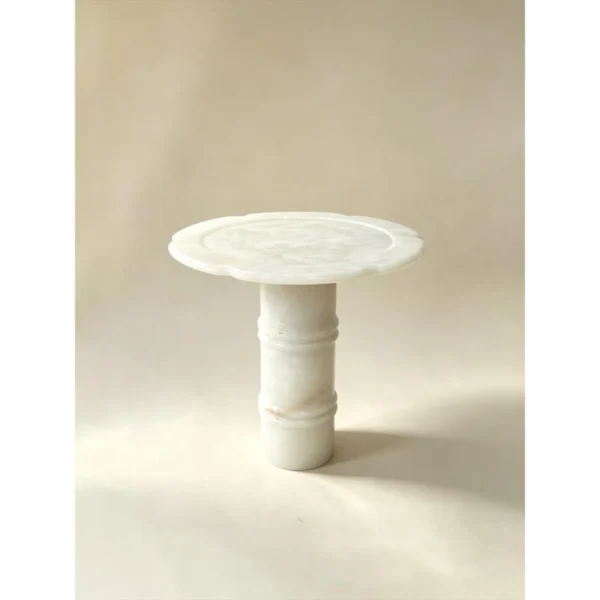 Xuezhan Snow Cup White Onyx Side Table with Plum Blossom Top in ivory — in a room setting