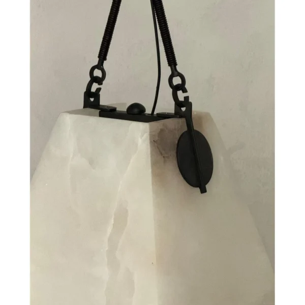 Cloud Alabaster Pendant Lamp with Leather Straps and Tassel in ivory — in a room setting