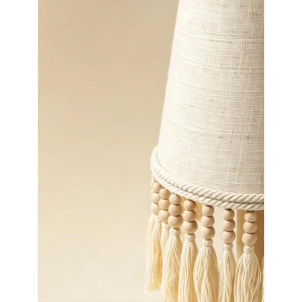 Yunluo Fringed Linen Cone Table Lamp with Wooden Beads in oatmeal — in a room setting
