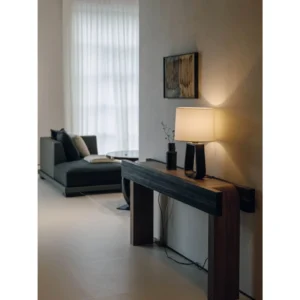 Tall Black Tripod Floor Lamp with White Drum Shade in black — in a room setting