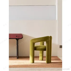 Avocado Green Velvet Sculptural Tub Chair, 65 cm in olive — in a room setting